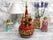 Boîte à musique tournante peinte à la main – Motif de basilique russe sur fond rouge fleuri