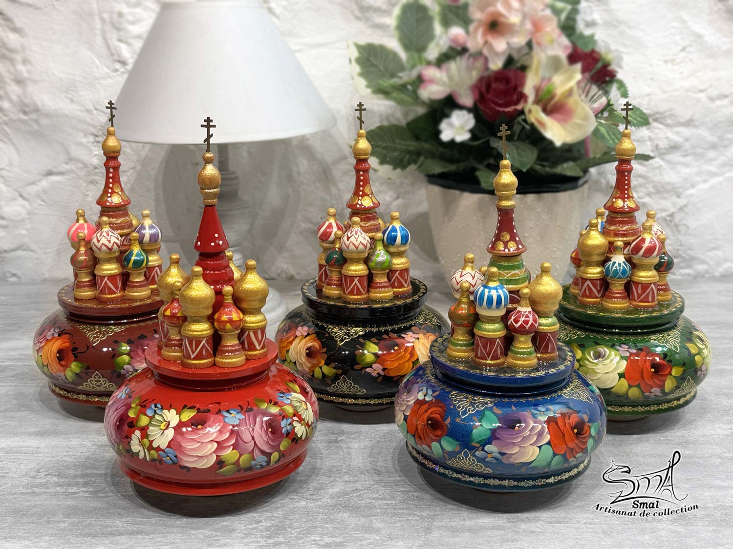Traditional Russian basilica music box with floral patterns on a red background