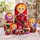 Russian Matryoshka nesting dolls set of 10, traditional Polkhov-Maidan floral folk art, colorful hand-painted wooden dolls displayed open and nested on a lace-covered table, with a Russian samovar, teacup and flowers in the background