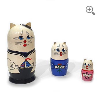 Hand-painted Russian cat sailor matryoshka set of three wooden nesting dolls, featuring white, black, blue and pink nautical costumes on a clean white background