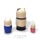 Back view of three hand-painted Russian cat sailor matryoshka dolls, showing the wooden backs and simple black, blue and pink painted details on a clean white background
