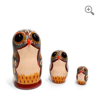 Three gray owls, nesting Russian matryoshka dolls, hand-painted with cream and golden feather motifs, 11 cm tall