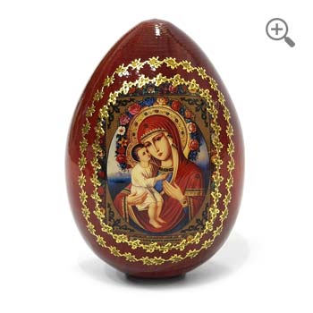 Decorative wooden Orthodox Easter egg featuring the Our Lady of Zhirovitsy icon with ornate gold embellishments.